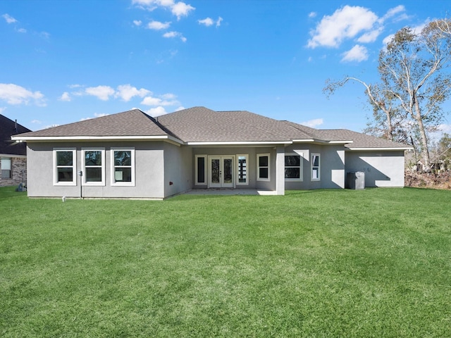 rear view of property featuring a yard