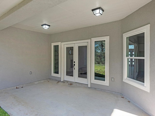 entrance to property with french doors and a patio