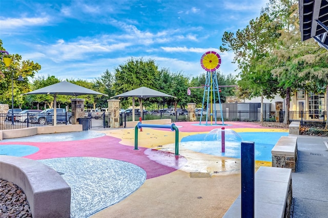 view of property's community with a playground