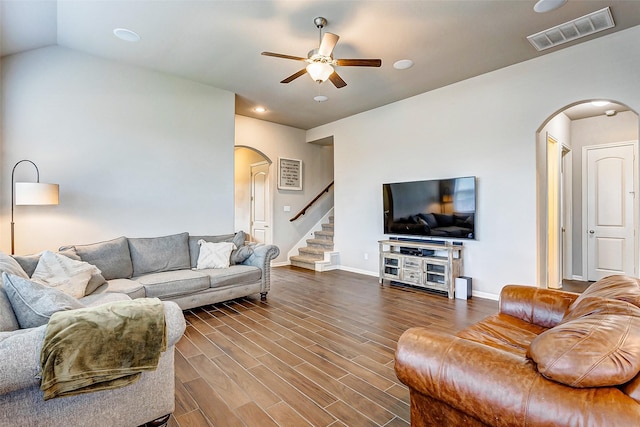 living room with ceiling fan, dark hardwood / wood-style flooring, and lofted ceiling