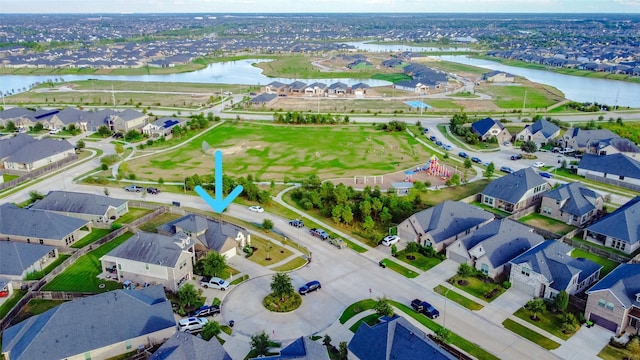 birds eye view of property featuring a water view