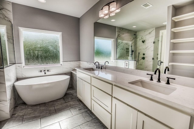 bathroom featuring vanity and separate shower and tub