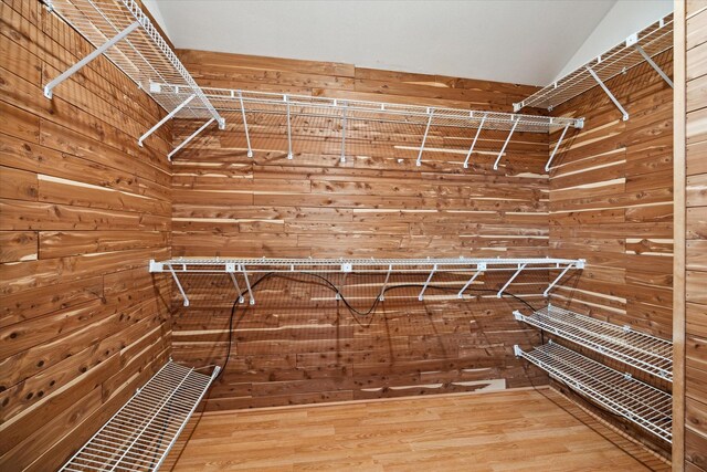 spacious closet featuring hardwood / wood-style floors