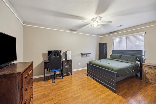 bedroom with ceiling fan and light wood-type flooring