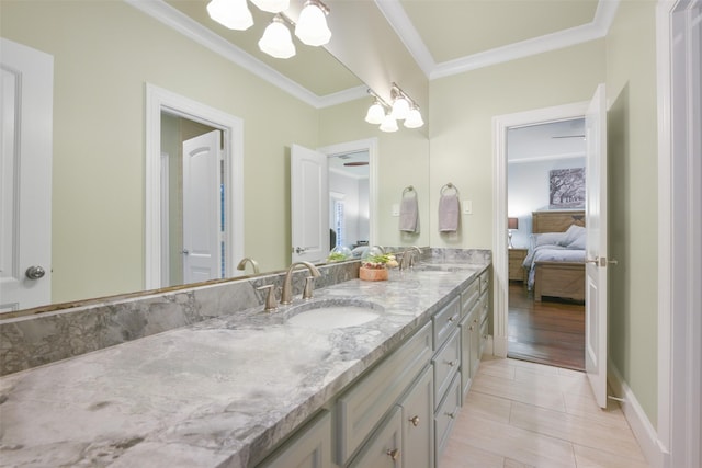 bathroom featuring tile patterned flooring, vanity, ornamental molding, and an inviting chandelier