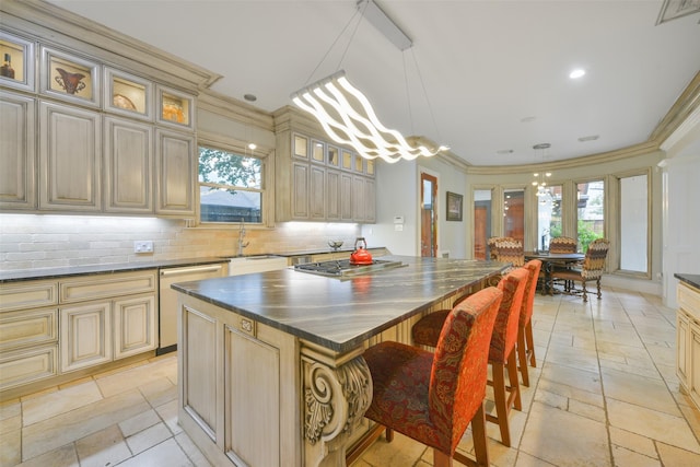 kitchen featuring pendant lighting, a center island, backsplash, sink, and stainless steel appliances