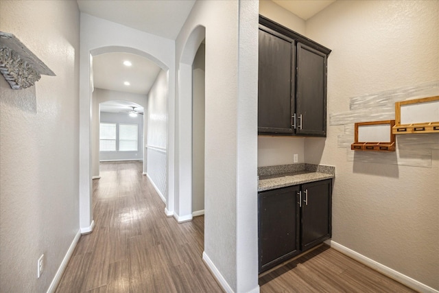 hall with hardwood / wood-style floors