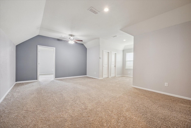 bonus room featuring ceiling fan, light colored carpet, and lofted ceiling