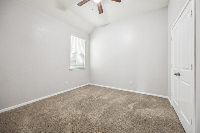 empty room with carpet floors, ceiling fan, and lofted ceiling