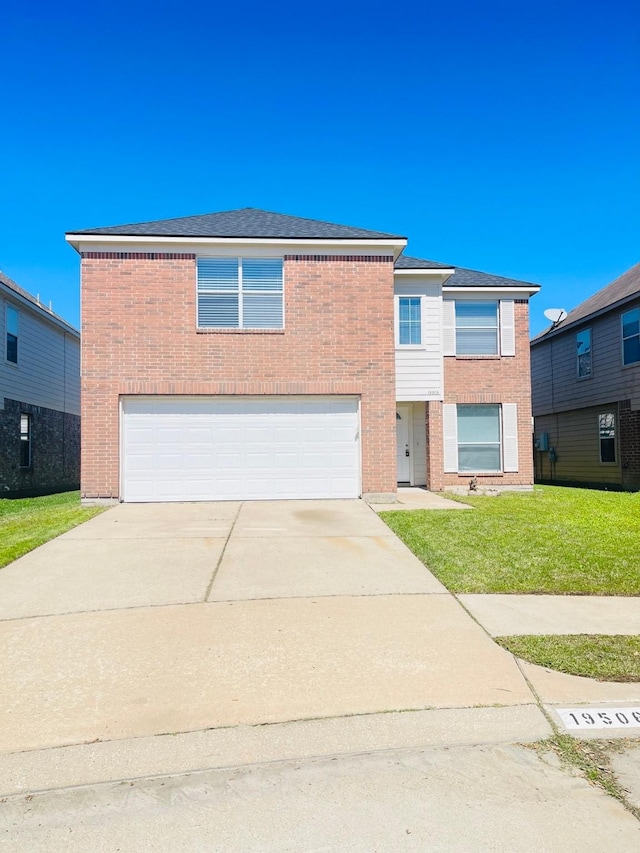 view of front facade with brick siding, an attached garage, concrete driveway, and a front lawn