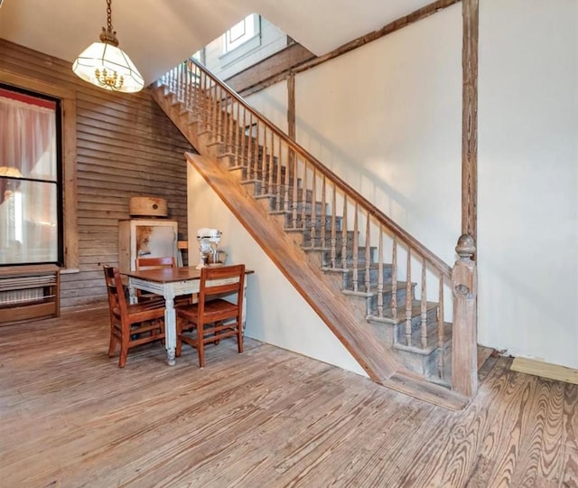 dining space featuring a chandelier and wood-type flooring