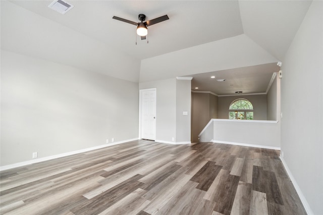 unfurnished living room with ceiling fan, hardwood / wood-style floors, and lofted ceiling