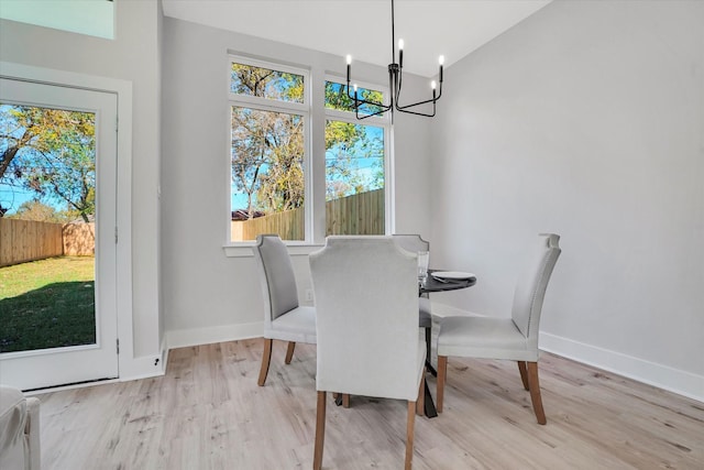 dining area featuring a chandelier and light hardwood / wood-style floors