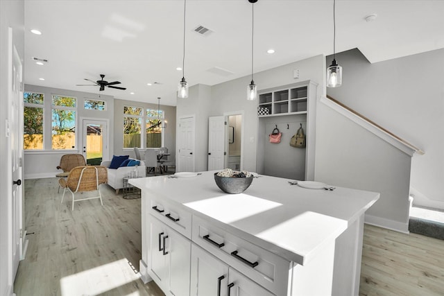 bathroom with hardwood / wood-style floors and ceiling fan