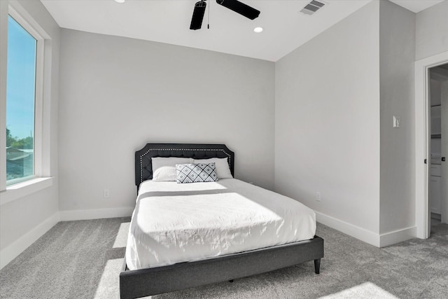 carpeted bedroom with ceiling fan