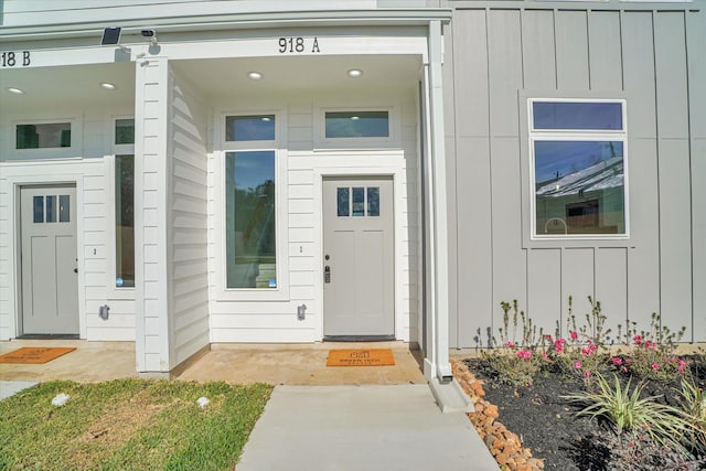 view of exterior entry with covered porch