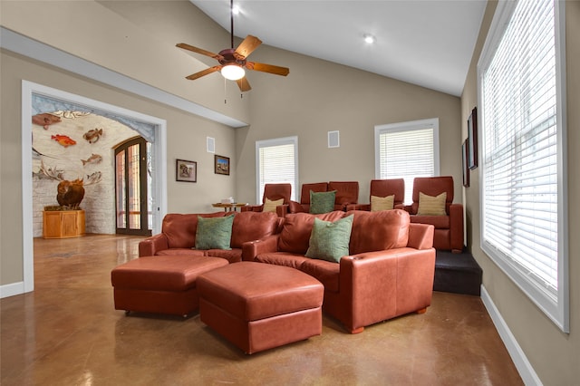 home theater featuring high vaulted ceiling, ceiling fan, and a wealth of natural light