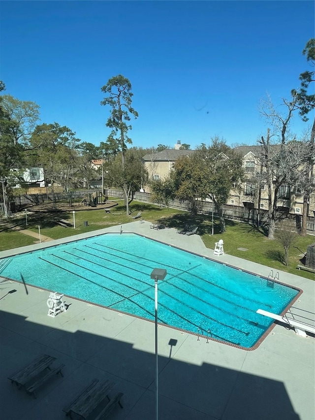 pool featuring a patio and a yard