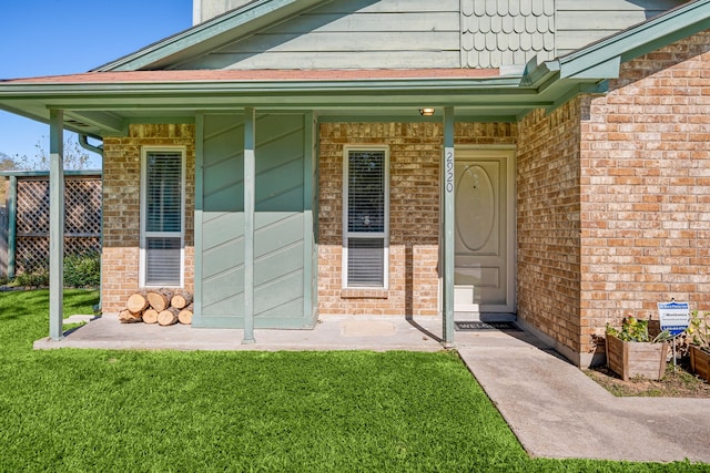 doorway to property with a yard