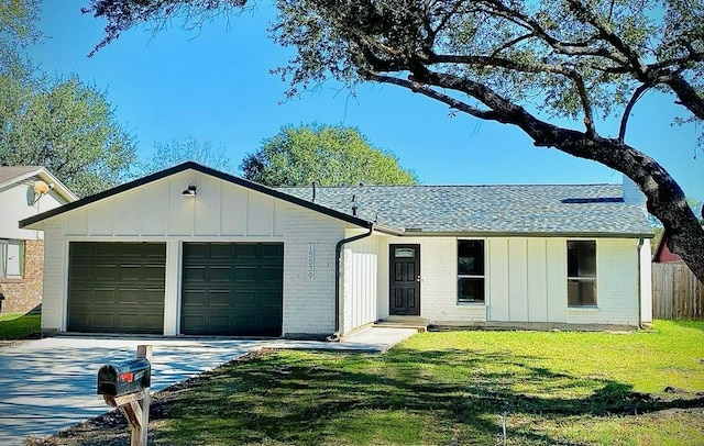 ranch-style house with a garage and a front lawn