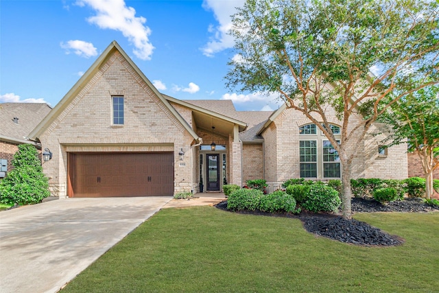 view of front of home with a garage and a front lawn