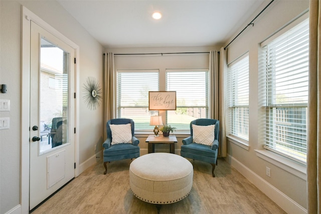 sitting room featuring light hardwood / wood-style floors