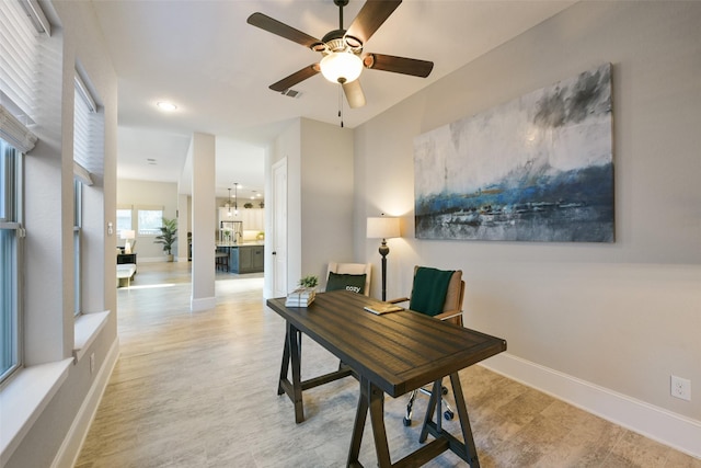 office featuring ceiling fan and light hardwood / wood-style floors