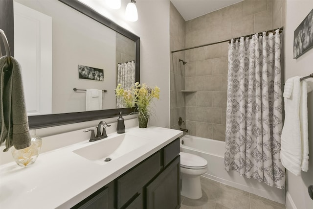 full bathroom featuring tile patterned flooring, shower / bath combo with shower curtain, vanity, and toilet