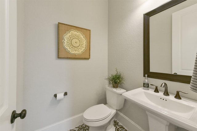 bathroom with toilet and sink