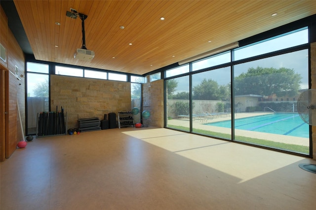 unfurnished sunroom featuring wooden ceiling