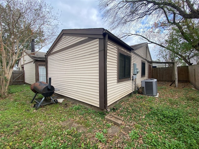 view of home's exterior with cooling unit