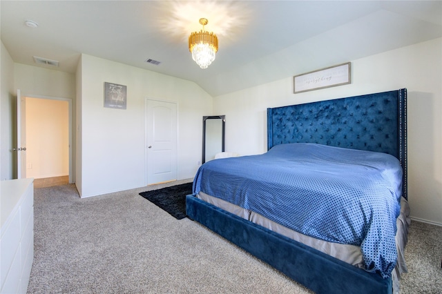 bedroom with carpet, vaulted ceiling, and an inviting chandelier