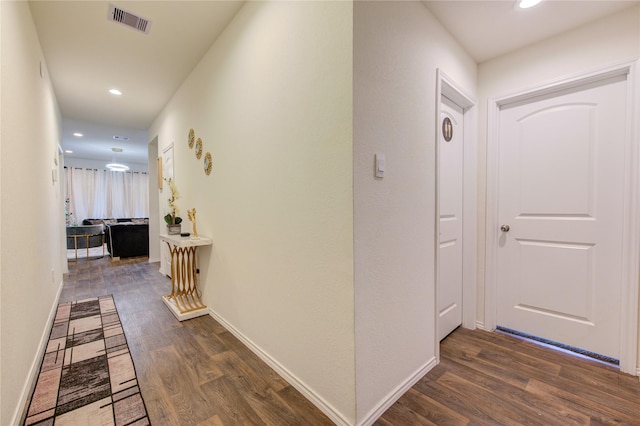 corridor featuring dark hardwood / wood-style flooring