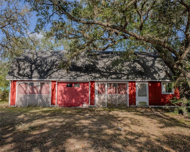 view of outdoor structure with a lawn