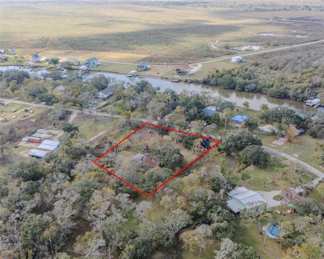 birds eye view of property featuring a rural view and a water view