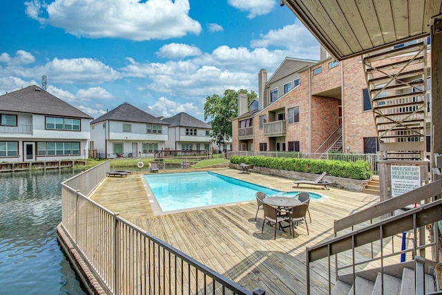 view of pool with a water view