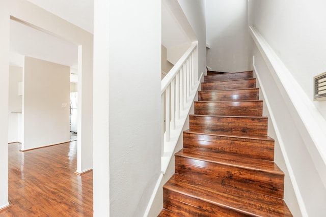 stairway featuring hardwood / wood-style floors