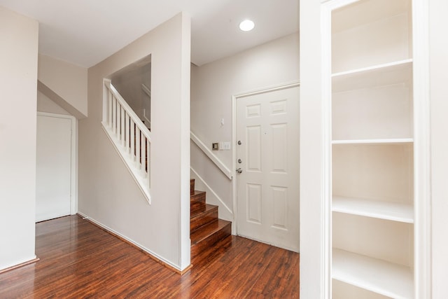 staircase featuring hardwood / wood-style flooring