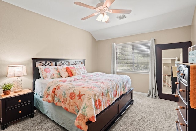 carpeted bedroom with ceiling fan and lofted ceiling