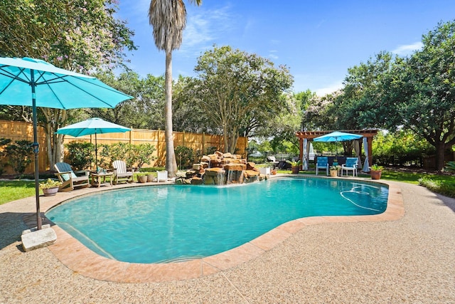 view of pool with a patio and pool water feature