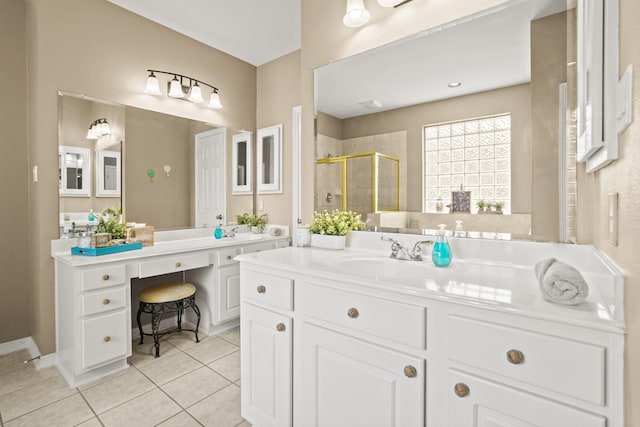 bathroom featuring a shower with door, vanity, and tile patterned flooring