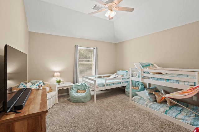 carpeted bedroom featuring ceiling fan and vaulted ceiling