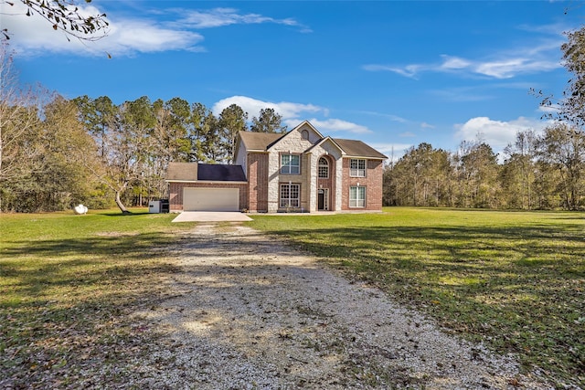 front facade with a front yard and a garage