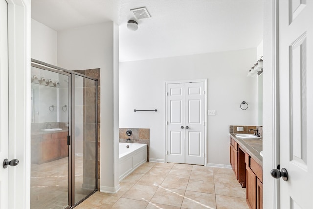 bathroom with vanity, tile patterned floors, and independent shower and bath