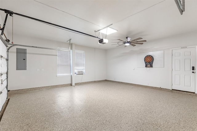 garage with ceiling fan, cooling unit, a garage door opener, and electric panel