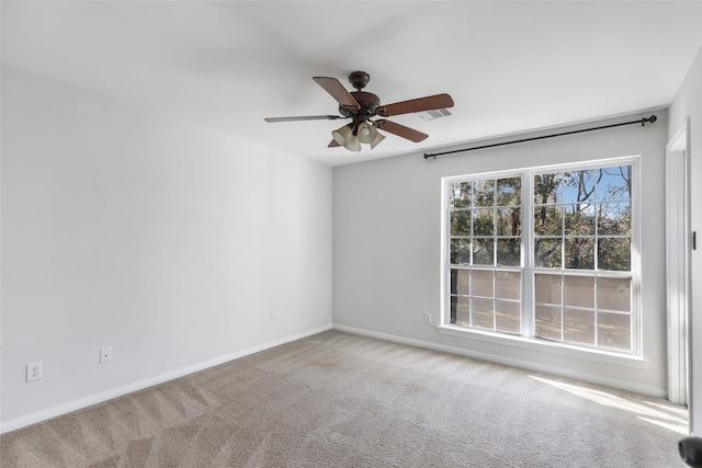 empty room with carpet floors and ceiling fan