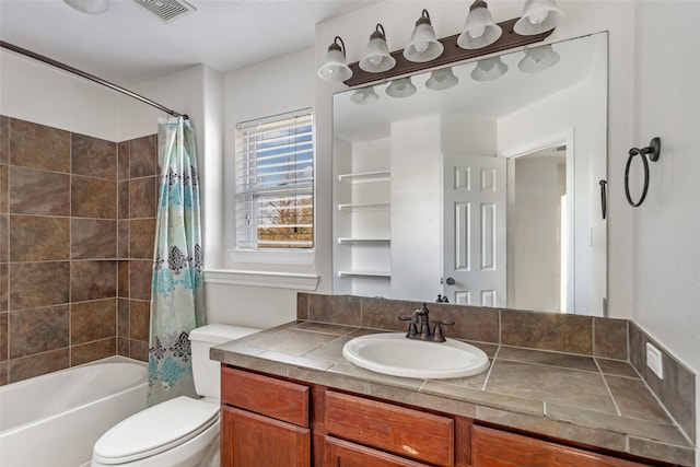 full bathroom with vanity, toilet, and shower / tub combo