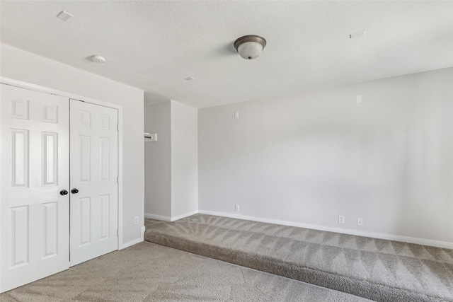 empty room with carpet flooring