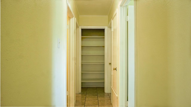 hall featuring light tile patterned flooring