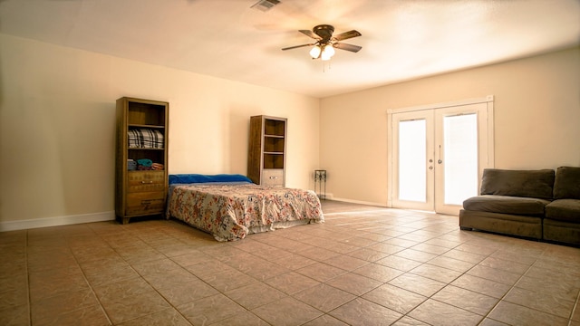 tiled bedroom featuring access to outside, ceiling fan, and french doors